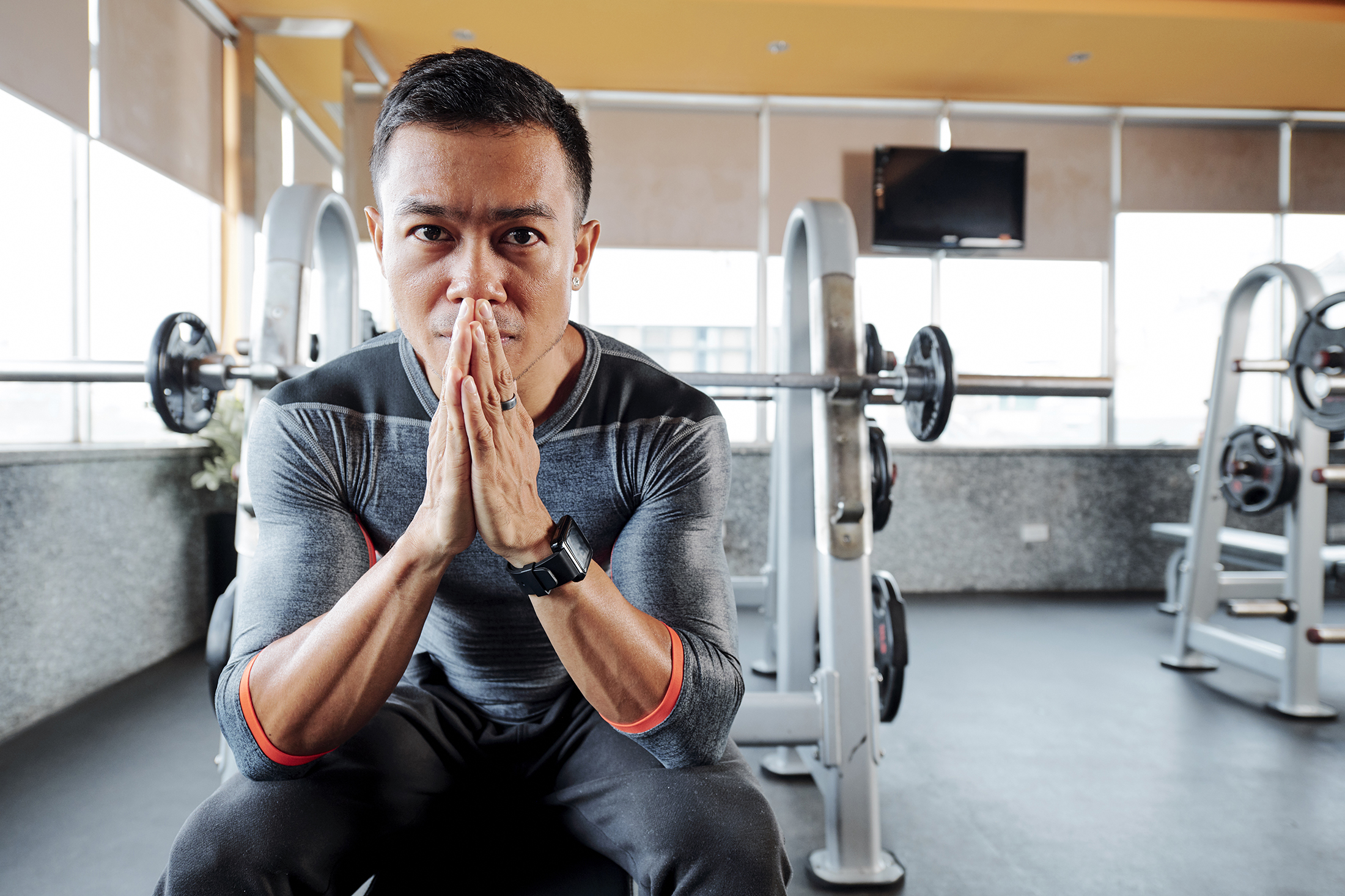 Serious gym owner with pain in his eyes praying for ending of the pandemic and opening gyms and sports clubs